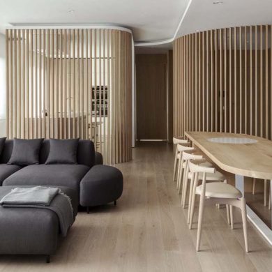 oak-slat-walls-divide-the-spaces-inside-this-apartment’s-interior