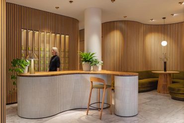 undulating-wood-walls-create-a-sense-of-calm-inside-this-massage-boutique