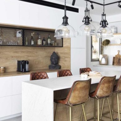 this-kitchen-island-was-designed-to-also-be-a-casual-dining-table-with-seating-on-both-sides