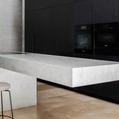 a-cantilevered-island-is-a-dramatic-feature-in-this-minimalist-kitchen