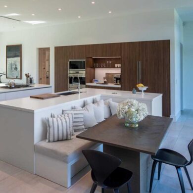 an-l-shaped-kitchen-island-is-a-creative-way-to-include-seating-and-a-table