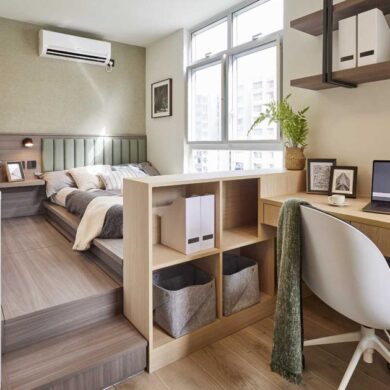 a-raised-bed-creates-a-separate-space-from-the-home-office-in-this-apartment-bedroom