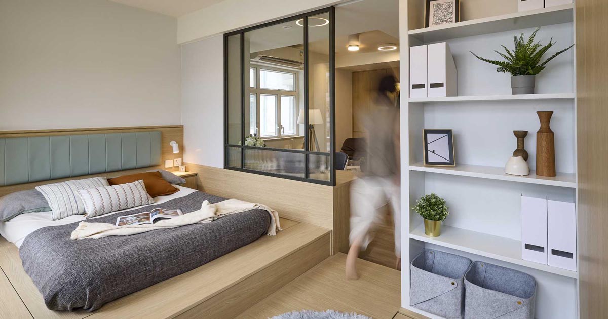 the-internal-window-in-the-bedroom-of-this-small-apartment-allows-light-into-the-living-room