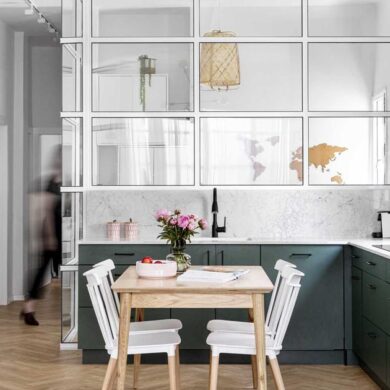 a-glass-enclosed-home-office-is-tucked-in-behind-the-kitchen-in-this-apartment