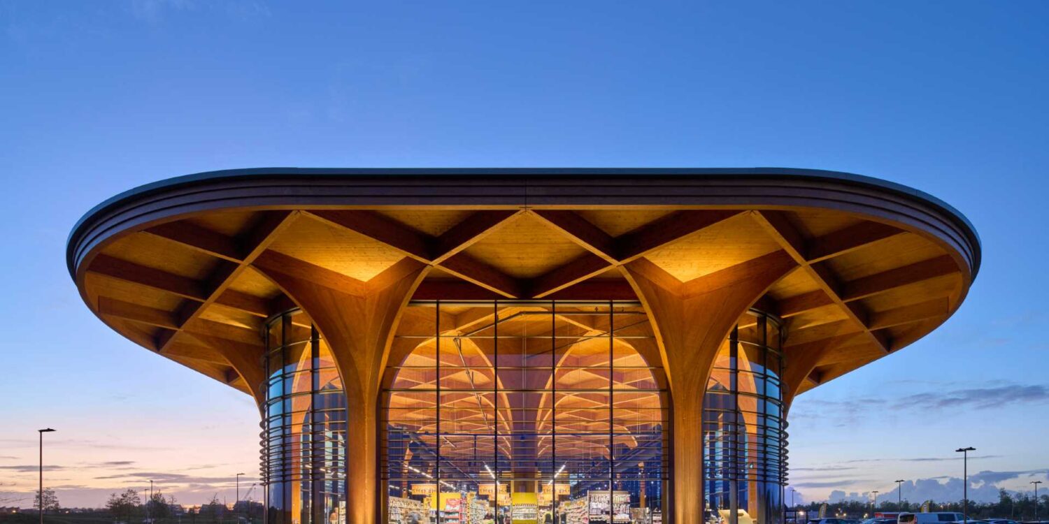 elegant-cathedral-like-wood-columns-support-a-canopy-over-this-new-supermarket