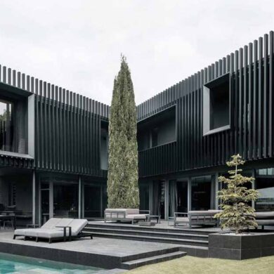 vertical-fins-surround-the-exterior-of-this-house-giving-it-a-distinct-appearance