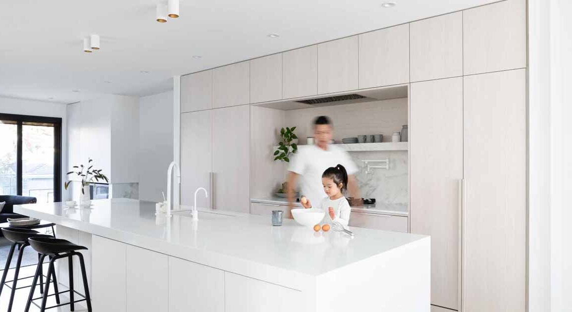 white-stained-oak-cabinets-paired-with-cool-white-marble-creates-a-soft-aesthetic-inside-this-home