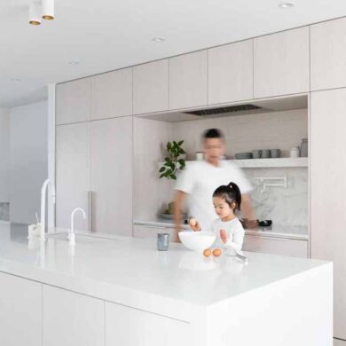 white-stained-oak-cabinets-paired-with-cool-white-marble-creates-a-soft-aesthetic-inside-this-home