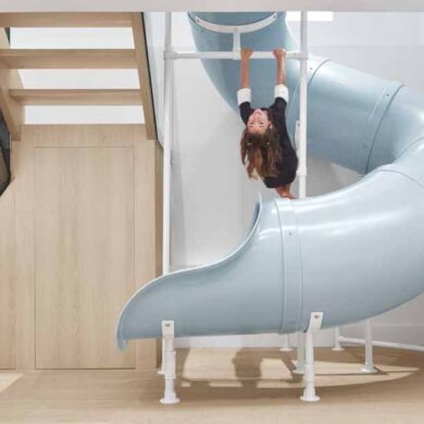 a-slide-connects-the-main-floor-with-the-kids-bedrooms-on-the-lower-floor-of-this-home