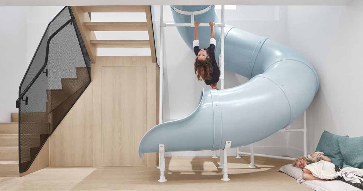 a-slide-connects-the-main-floor-with-the-kids-bedrooms-on-the-lower-floor-of-this-home