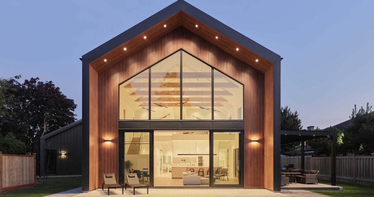 a-vaulted-ceiling-is-a-dramatic-feature-inside-this-modern-barn-house