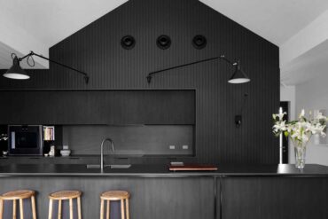 a-black-kitchen-is-a-bold-design-choice-for-this-home