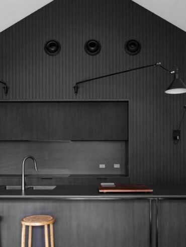 a-black-kitchen-is-a-bold-design-choice-for-this-home