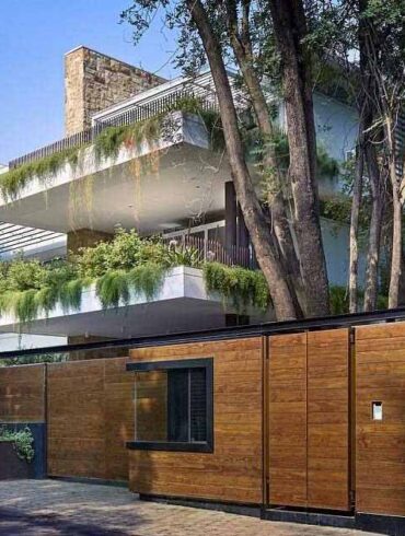 overhanging-plants-surround-the-exterior-of-this-home