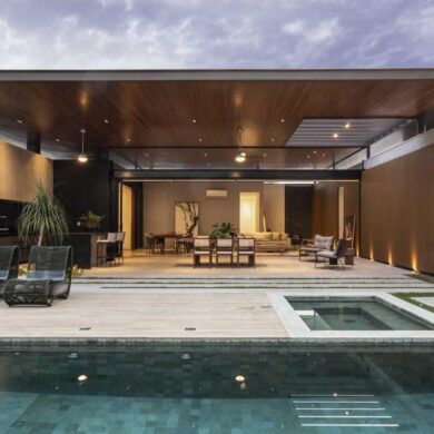 a-large-double-height-ceiling-allows-the-social-areas-of-this-home-to-open-completely-to-the-outside