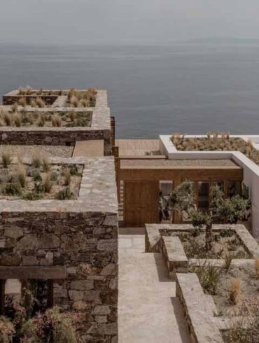 green-roofs-with-native-plants-enhance-this-home-built-into-a-rocky-hillside