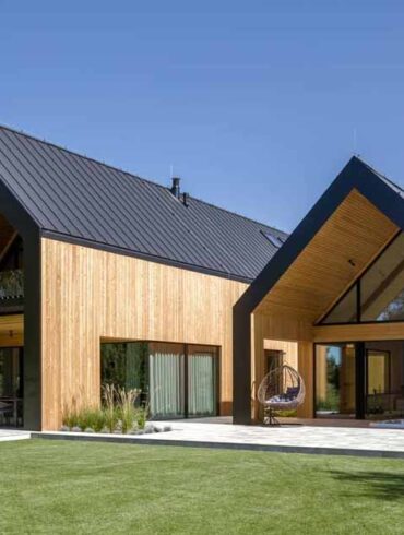 a-house-designed-like-two-barns-beside-each-other