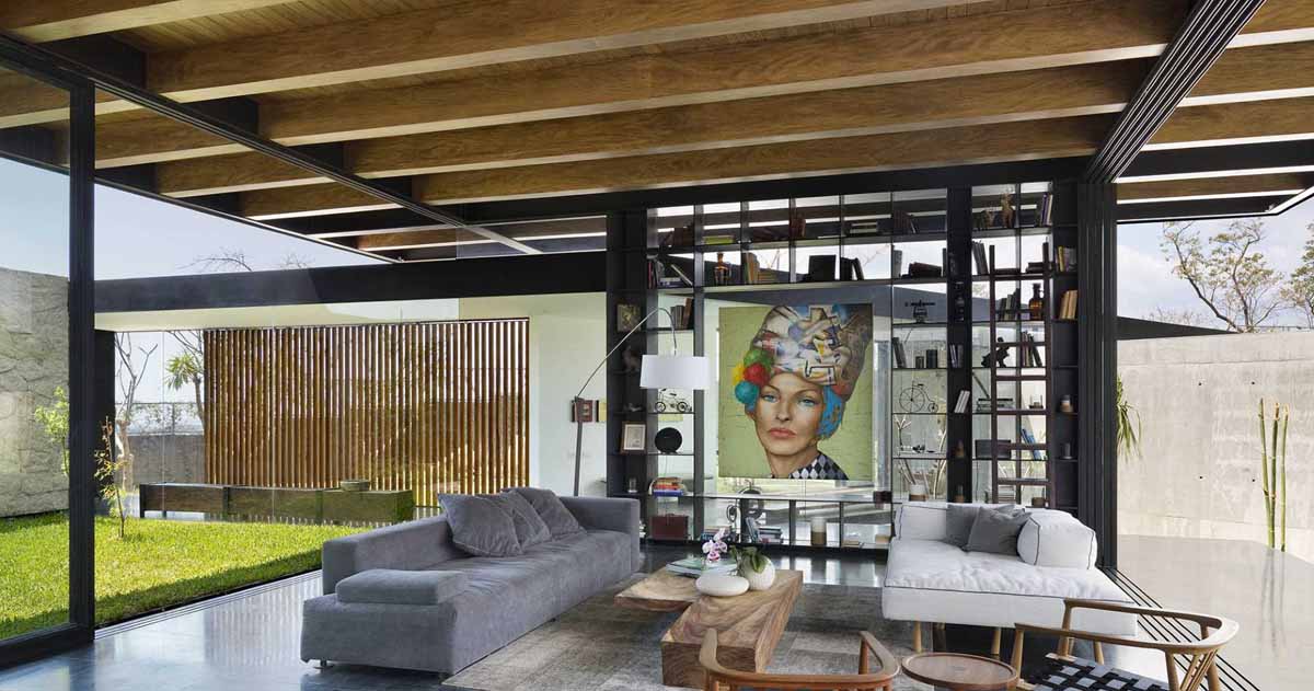 the-exposed-wood-ceiling-of-this-home-shows-off-its-structure