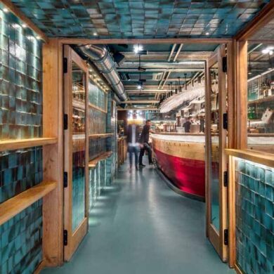 handmade-turquoise-tiles-line-the-entrance-to-this-spanish-restaurant