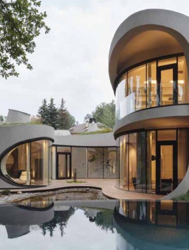 this-sculptural-home-is-full-of-curves-and-surrounded-by-landscaping