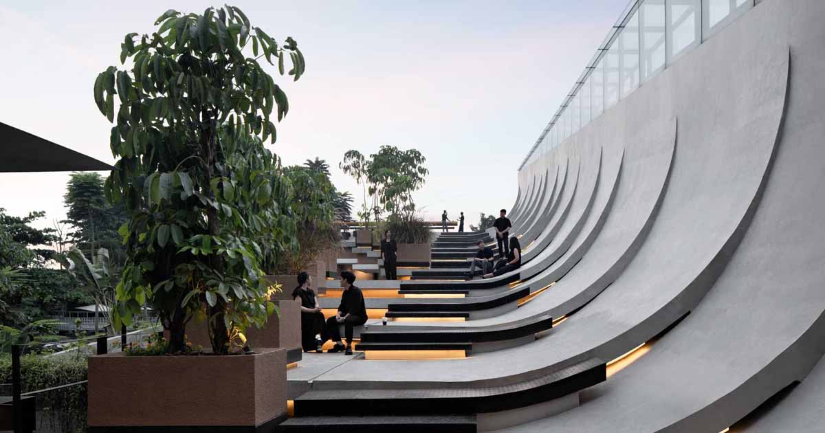 this-building-with-a-split-roof-makes-space-for-a-rooftop-park