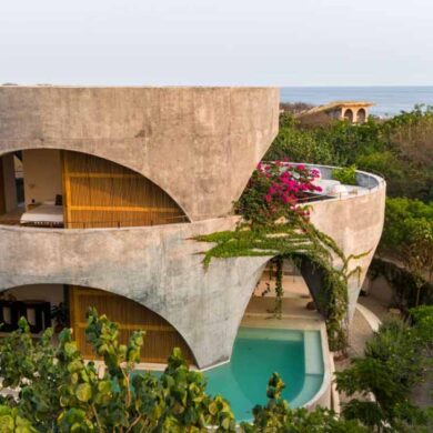 a-round-design-and-open-arches-give-this-concrete-home-a-unique-look