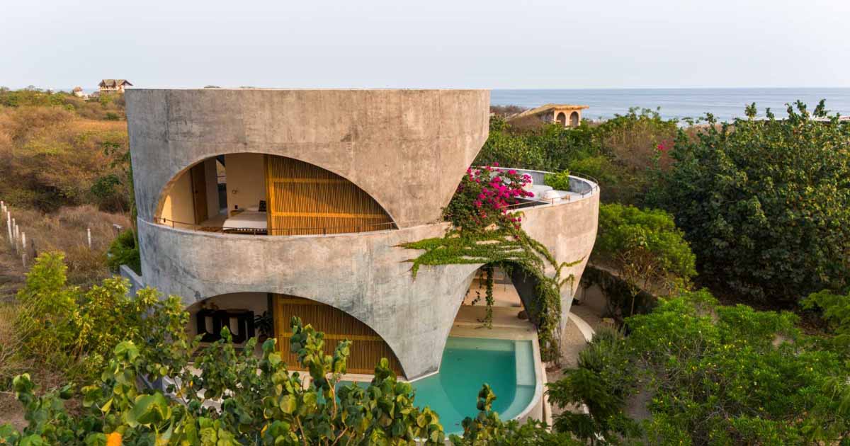 a-round-design-and-open-arches-give-this-concrete-home-a-unique-look