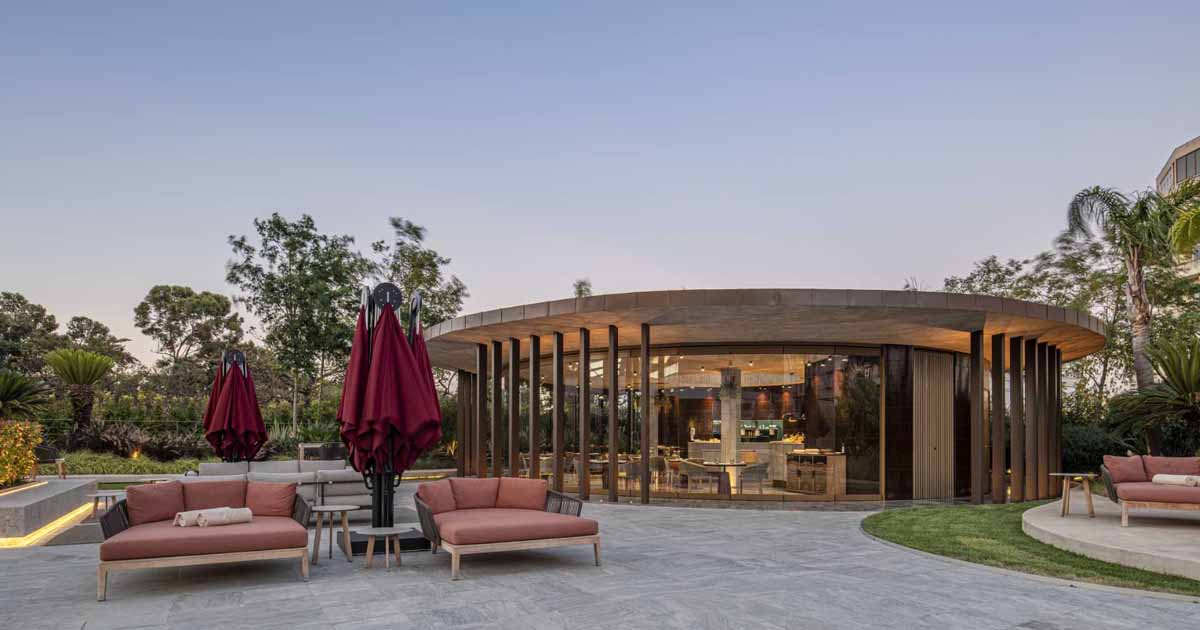 a-concrete-ceiling-floats-above-this-round-hotel-bar