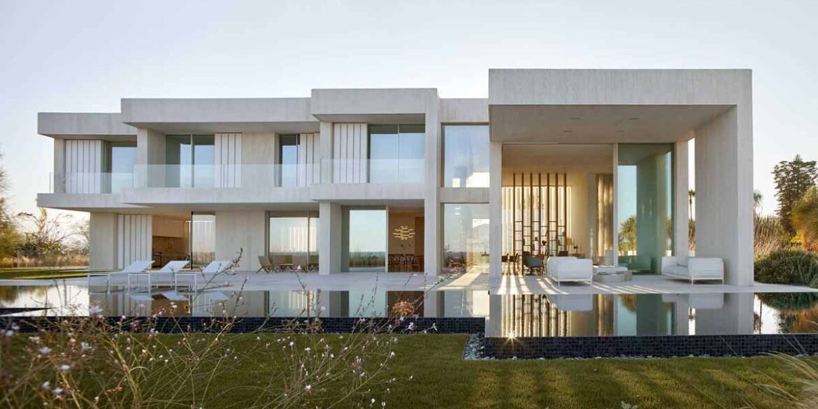 a-white-concrete-exterior-protects-this-seaside-mediterranean-house