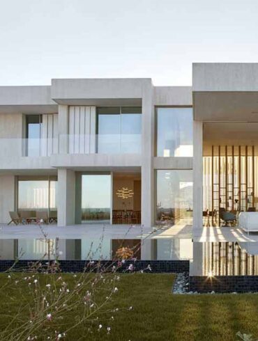 a-white-concrete-exterior-protects-this-seaside-mediterranean-house