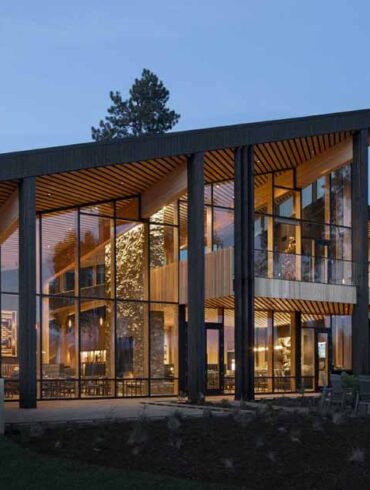 a-warm-wood-interior-contrasts-with-the-black-charred-cedar-exterior-at-this-ranch-lodge-in-oregon