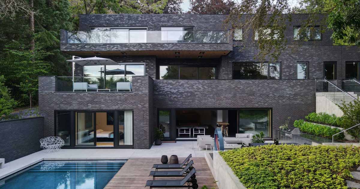 a-dark-brick-exterior-for-a-home-surrounded-by-trees